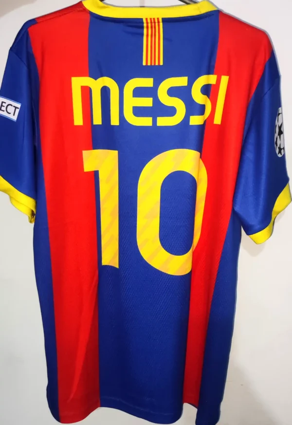 Back view of FC Barcelona Jersey 2010 with customizable options: "Back view of FCB Jersey Messi 10 showing customizable name and number options."