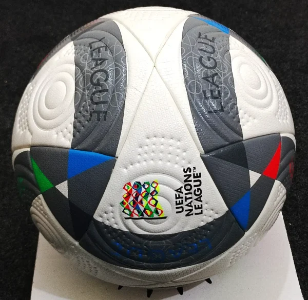 Side profile of the Adidas UEFA Nations League 2024 Ball displaying the White, Iron Metallic, and Silver Metallic colors inspired by European football scarves