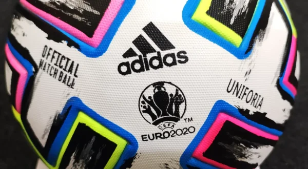 Close-up of Adidas Uniforia Euro 2020 soccer ball showing thermally welded TPU cover and butyl bladder for durability